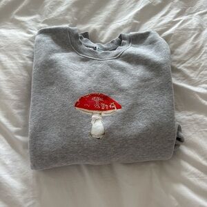 Aritzia Gray Sweater with Red Mushroom Design